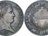 a close up of a coin with a woman ' s face on it