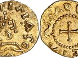 an image of a gold coin with a cross on it
