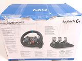 a box with a steering wheel and a game controller in it