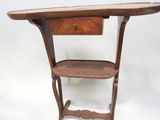 an old wooden table with a drawer on top of it