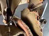 a pair of baseball mitts hanging from a rack