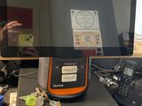 someone is taking a picture of a tablet computer on a desk