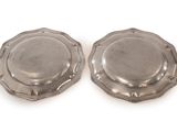 pair of silverplated dishes on a white background