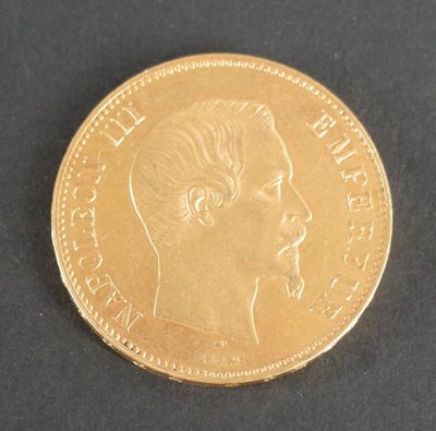 une pièce d'or sur laquelle figure le visage d'un homme