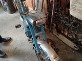 a bike that is parked next to a fence