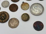 a lot of coins that are sitting on a table