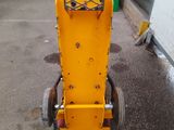 an image of a small machine that is parked in a garage