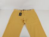 a pair of yellow pants with a tag on the bottom