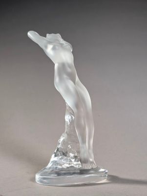 sculpture of a female figure on a clear base on a gray background