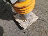 a yellow fire hydrant sitting on the side of the road