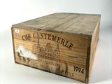 an old wooden box with a label on it sitting on a table