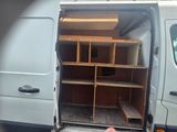 a white van with shelves in the back of it