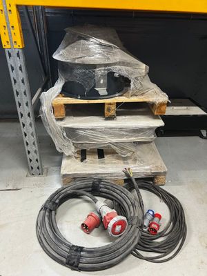 two hoses sitting on a pallet in a warehouse