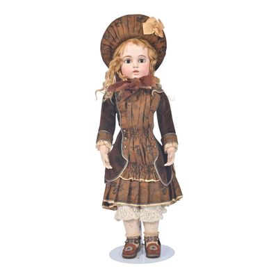 a doll that is wearing a brown dress and hat