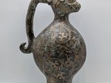 an old vase with a handle on a white background