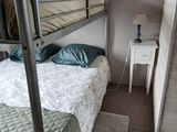 a bunk bed in the corner of a room