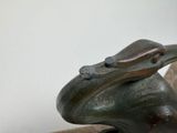 a statue of a bird with a hat on it ' s head