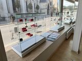 a glass display case with a lot of items on it
