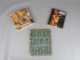 three books that are sitting on a table