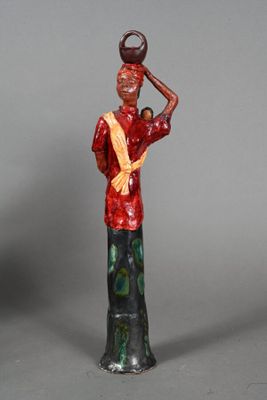 figurine of a woman carrying a pot on her head