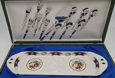 a box with a set of forks and spoons in it
