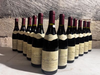 several bottles of wine lined up in a row on a table