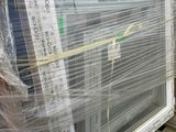 a large window that is wrapped up on a pallet