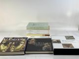 several books sitting on top of each other on a table