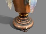 an image of a vase with a bird on top of it