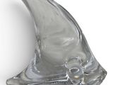an image of a glass sculpture of a shark fin on a white surface