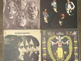 the byrds album covers on a carpeted floor