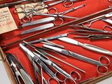many pairs of scissors in a case on the table