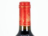 a bottle of wine that is sitting on a table