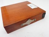 an image of a wooden box with a key on it