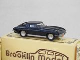 a blue toy car sitting on top of a box