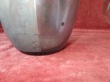 a vase with flowers in it sitting on a red couch