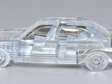 a clear toy car that is sitting on a table
