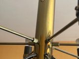 a close up of a bike wheel with a cup of coffee