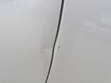 a close up of a car ' s door handle and door handle