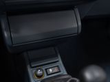 a close up of a car ' s dashboard with a button