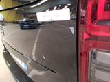 a close up of a car ' s tail light with a sticker on it