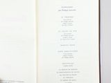 someone is holding a book open to a page with a list on it