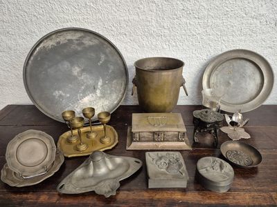 a table that has a lot of silver items on it