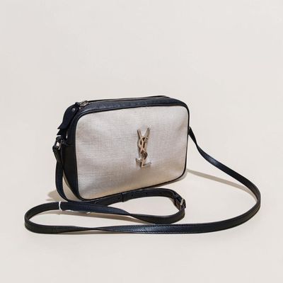 a white and black purse with a rabbit on it