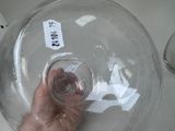 a person holding a glass of water in their hand