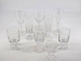 a lot of glasses that are sitting on a table