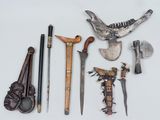 many different types of weapons displayed on a white surface