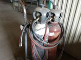 a fire extinguisor with a hose attached to it