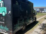 an image of a food truck parked on the side of the road