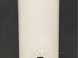 a large white water heater sitting on top of a tiled floor